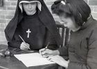 Columban Sister and girl studying